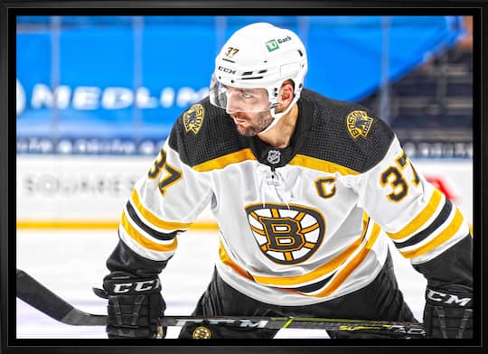Patrice Bergeron Boston Bruins Framed 20" x 29" Face-Off Canvas 31.5" x 22.5"